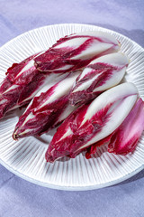 Group of fresh red Radicchio chicory or Belgian endive vegetables, also known as witlof salade