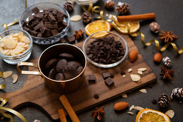chocolates, ingredients on black table  