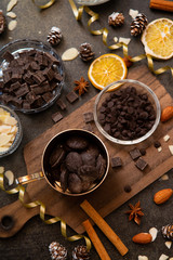 chocolates, ingredients on black table  