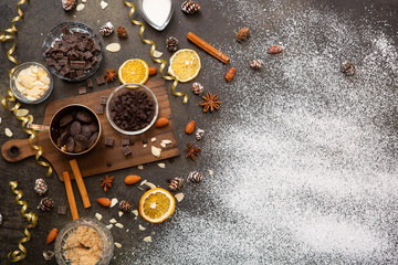chocolates, ingredients on black table  