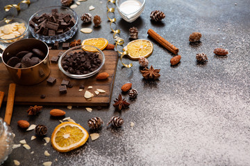 chocolates, ingredients on black table  