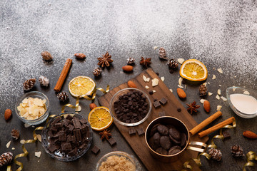 chocolates, ingredients on black table  