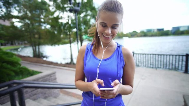 Latin American female filming a video diary of her in exercise clothes
