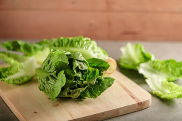 ripe organic green salad Romano on a cutting board