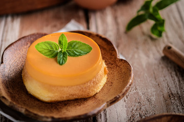 homemade caramel custard pudding with mint