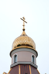 Fototapeta na wymiar Russia, Vladivostok, July 2018: Golden domes. Church of the Holy Spirit Igor Chernigov