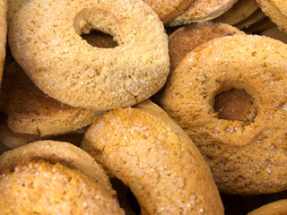 Fototapeta na wymiar A bunch of crispy round bagel cookies. Cropped shot, background, horizontal, top view, nobody. The concept of healthy and harmful food.