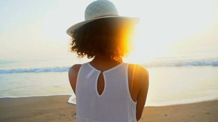 Portrait of young ethnic girl taking selfie on smartphone on ocean beach