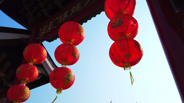 Red Chinese lantern hanging in joss house or Chinese temple, for celebrate Chinese New Year festival, 4k ultra HD slow motion.