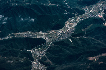 aerial view of town and green mountains