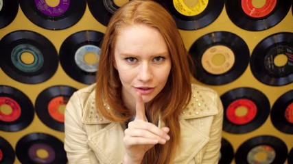 Female in mall making selfie video diary USA