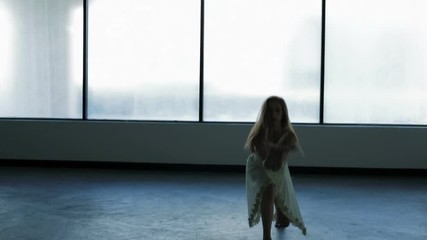 Caucasian young girl freestyle dancing in silhouette