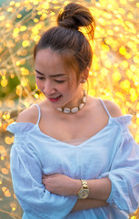 Fototapeta premium portrait asian beautiful women of smiling with blur bokeh light background and fashion shirt white or jeans