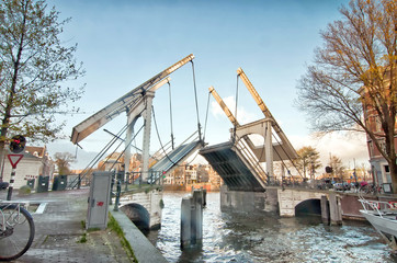 Drawbridge is opening in the centre of Amsterdam,  Netherlands.