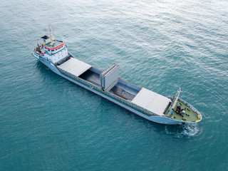 General cargo ship at sea - Aerial image.