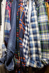 Assorted Men's Shirts Hanging in a Closet