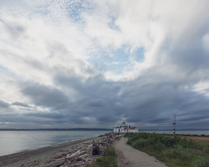 Path leading to the Victorian-era lighthouse in Discovery Park, Seattle, USA