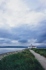 Path leading to the Victorian-era lighthouse in Discovery Park, Seattle, USA