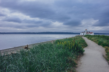 Path leading to the Victorian-era lighthouse in Discovery Park, Seattle, USA