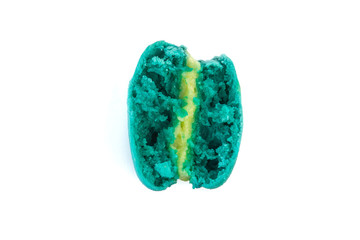 Sweet colorful macaron broken and bite isolated on white background.