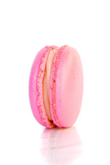 Sweet colorful macaron living coral color isolated on white background.