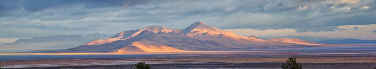 Antelope Island view from Magna, sweeping cloudscape at sunrise with the Great Salt Lake State Park...