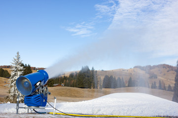 Cannon fires snow on the ski slopes