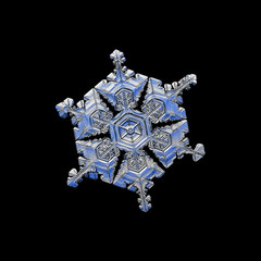 Snowflake isolated on black background. Macro photo of real snow crystal: complex, big star plate...