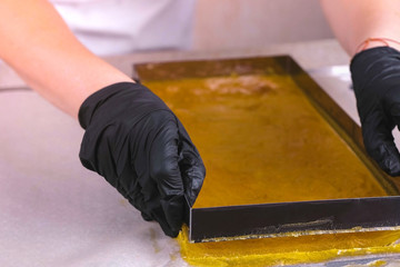 Marmalade removed from the mold. Production of sweets. Apricot marmalade for filling.