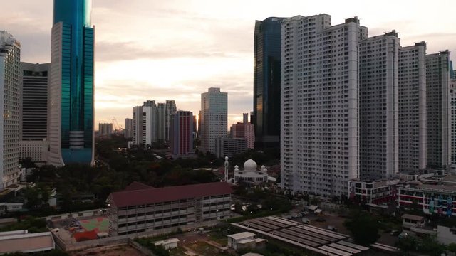 JAKARTA, Indonesia - January 22, 2019: Beautiful aerial scenery of apartment and modern office buildings on the morning in Jakarta, Indonesia. Shot in 4k resolution