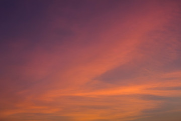 Obraz premium bright pink and yellow clouds in a dark blue purple sunset sky