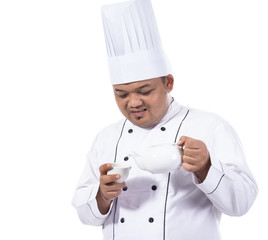 images of asian chef pour tea to cup