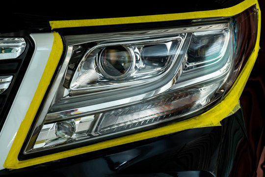 Closeup Car Lamp Or Front Headlight Polishing