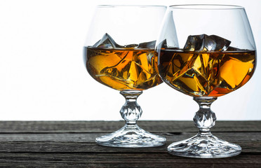 glasses for brandy close-up on an old wooden background