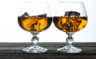 glasses for brandy close-up on an old wooden background