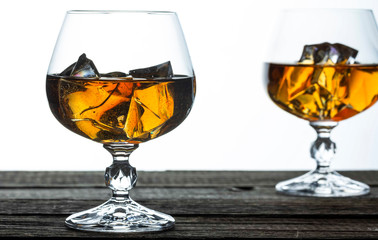 glasses for brandy close-up on an old wooden background