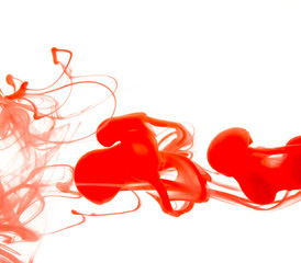 Color drop in water on a white background close-up, abstraction