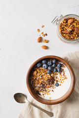 Homemade granola muesli with blueberries on white background breakfast