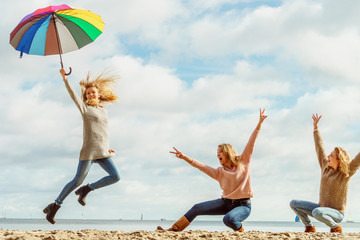 Women jumping with umbrella © anetlanda