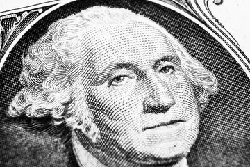 US president George Washington face portrait on the USA one dollar note. Macro shot. Background of the money. George Washington eyes macro shot. Black and white