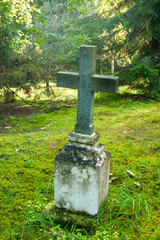 Cross at old beautiful semetery in Finland.