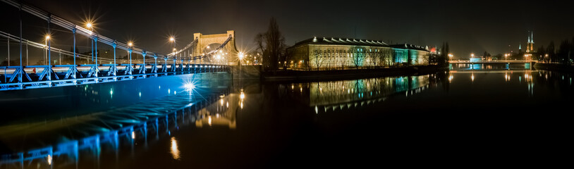 Night panoramic view of the Odra River in a beautiful city of Wroclaw located in the southwestern part of Poland