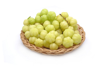 Star gooseberry with green leaves (Phyllanthus acidus) known as Otaheite gooseberry, Malay, Tahitian, Country, West India gooseberry and Starberry. Isolated on white background.