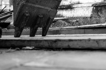 Construction site and excavator part on the ground