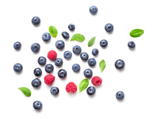 top view of blueberry and rapsberry fruits isolated on white background