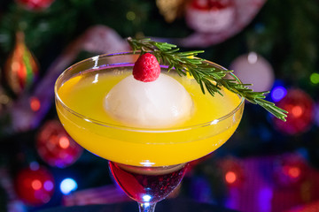 cocktail on a dark background with a christmas background