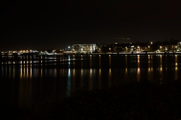Fototapeta na wymiar A city waterscape on a very dark night