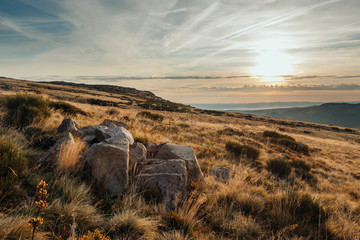 Big rocks in the mountains in front of the view of the valley