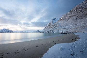 Long exposure polar night landscape of beach with mountain in the winter