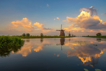 Sunset above old dutch windmills in Kinderdijk, Netherlands